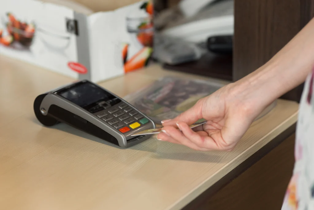 woman while using POS machine