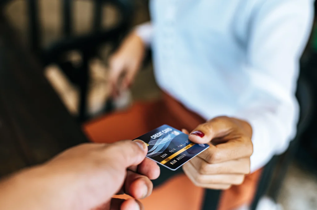 Customer paying with card at POS terminal