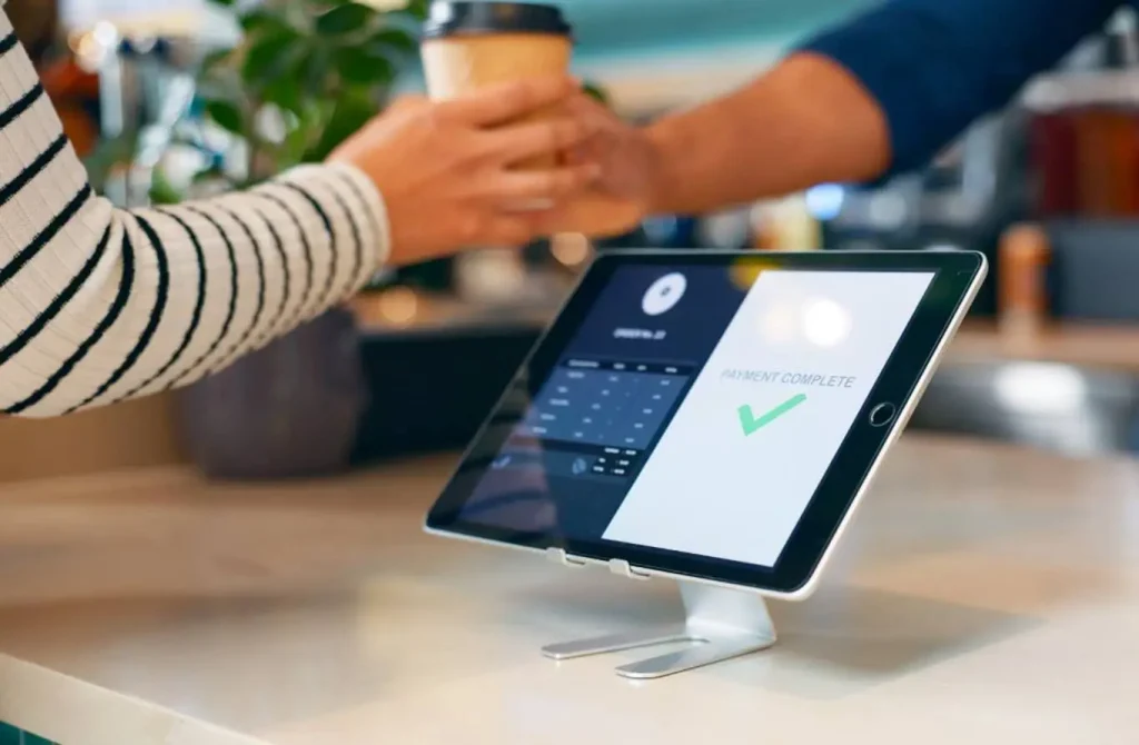 Barista using coffee shop POS system