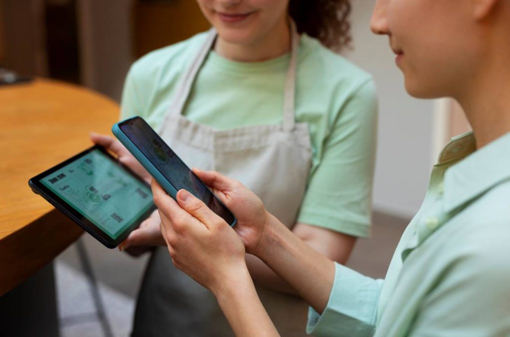 Staff using tablet-based POS system for order management