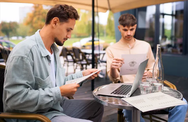 Business owners reviewing ecommerce payment processor options