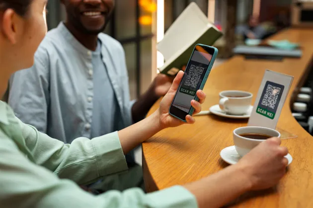Customers scanning QR code for contactless payments