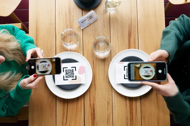 Customers scanning QR codes for contactless payments