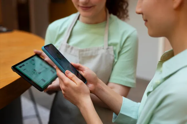 Staff processing orders with mobile POS device