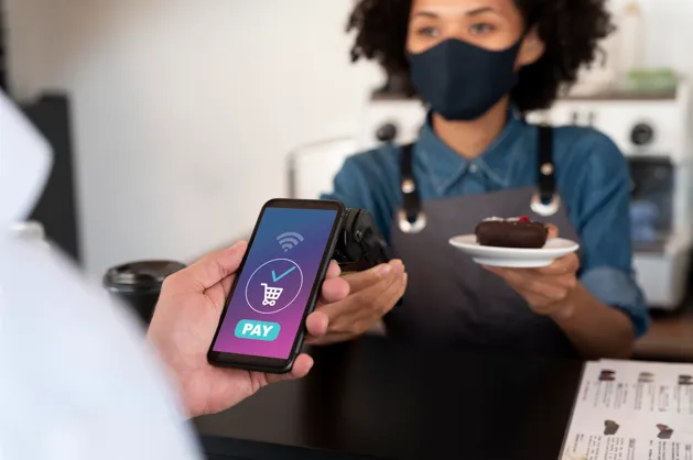 Customer making contactless café payment