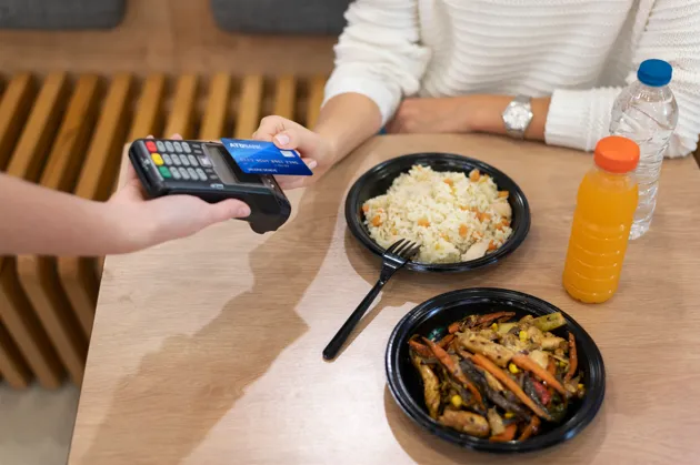 Customer making contactless restaurant payment