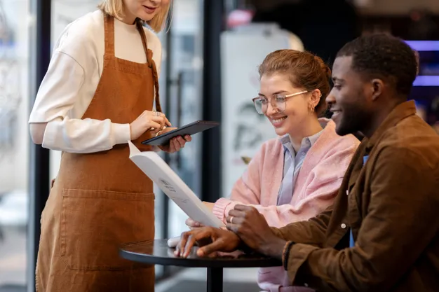 Restaurant staff taking customer order