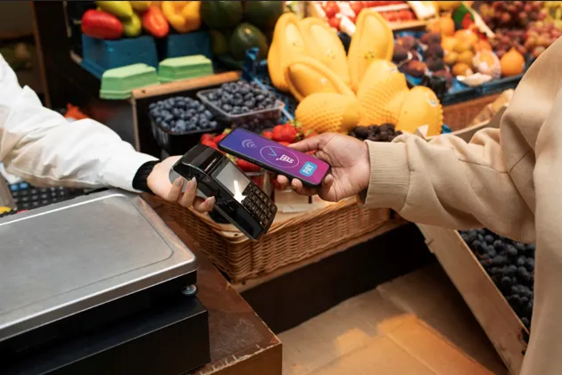Retail cashier processing secure digital POS payment
